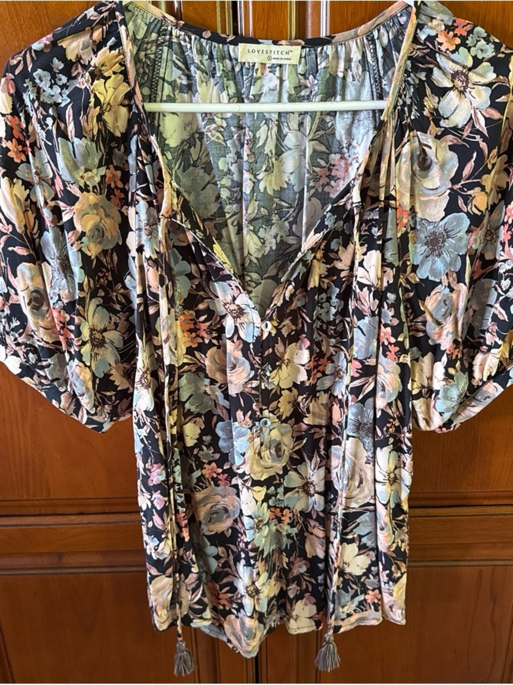 lovestitch Black Floral V-Neck Tie-Front Blouse with Tassels
